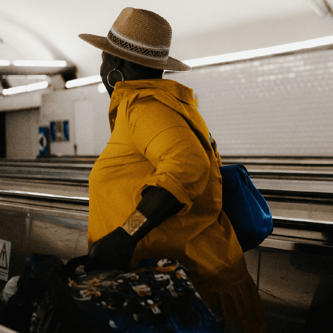 Woman, walking through an airport terminal, holding a suitcase.

Image by: Mathias Reding